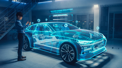 Automotive Engineer Uses Digital Tablet with Augmented Reality for Car Design Analysis and...