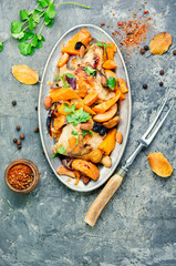 Baked chicken with pumpkin.