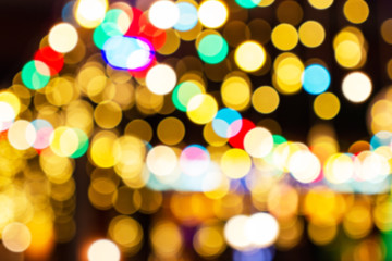 Blurred image Decorative outdoor string lights hanging in the garden at night time festivals season - decorative Christmas lights - happy new year 