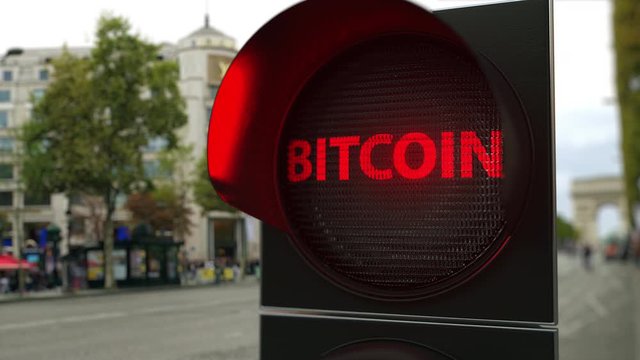 BITCOIN text on red traffic light signal. Cryptocurrency ban related conceptual 3D animation