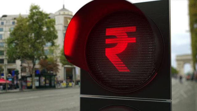 Rupee sign on red traffic light signal. Forex related conceptual 3D animation