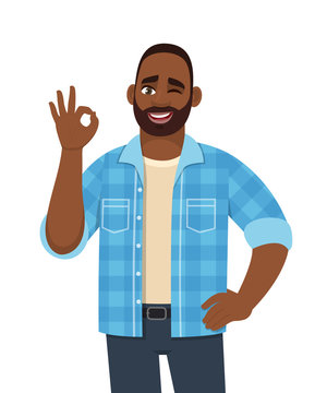 Happy young bearded African man showing okay, cool gesture with winking eye. Trendy successful black person making OK, good symbol. Male character design illustration in vector cartoon style.
