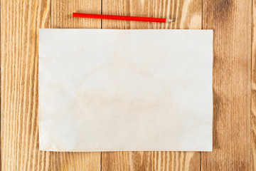 Sheet of paper lying on wooden table