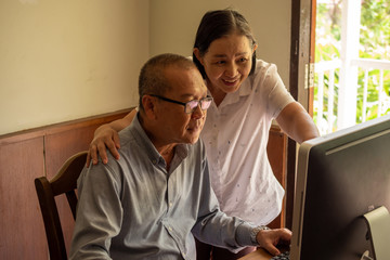 Asian woman supporting businessman at the office room.