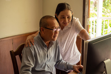 Fototapeta premium Asian woman supporting businessman at the office room.