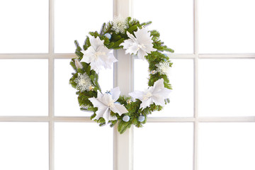 Beautiful Christmas wreath hanging on window
