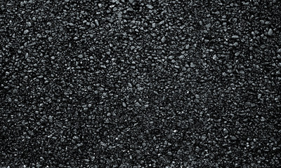 Dark asphalt roadbed.