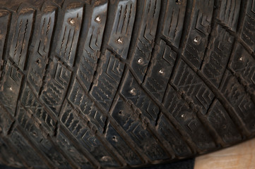 Close-up tire wheel of truck with metal inserts