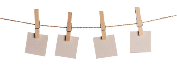 Set of blank notes held on string isolated