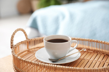 Tray with cup of fresh hot coffee at home