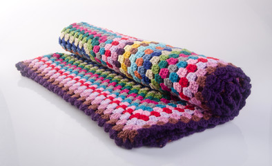 blanket or crochet blanket on a background new.
