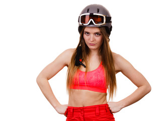 Woman wearing ski suit and helmet with goggles