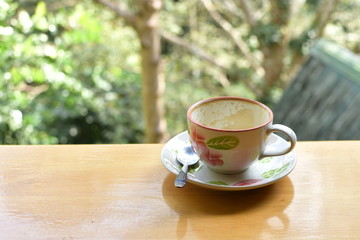 Empty coffee cup set on wood table with blur background, refreshment on morning time, relaxing in the coffee shop.