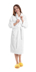 Young woman in bathrobe on white background