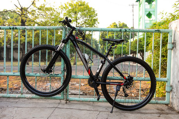 Bicycle Locked to a Fence-Security and Anti-Theft