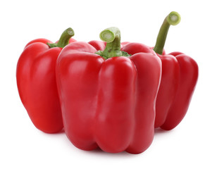 Ripe red bell peppers isolated on white