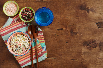 Bowl of Surimi Seafood Salad with sweet corn, cucumbers, boiled eggs and mayonnaise