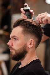 Client visiting hairstylist in barbershop. hair styling