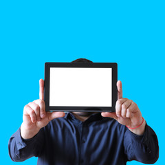 Man holding a tablet in hands. Screen instead of face. New technologies communication. Copy space place. Isolated on blue background.