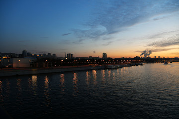 Fototapeta premium sunset on the river in the city