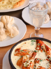 Georgian food. Chakhokhbili from chicken, khinkali, khachapuri