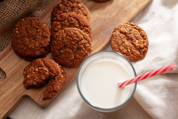 Chocolate crispy cookies with glass of milk close up