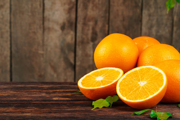Sliced into pieces juicy ripe oranges close up