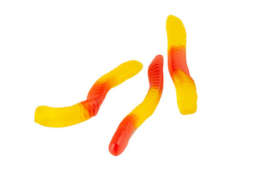 Jelly worms or snakes candies on a white background isolation