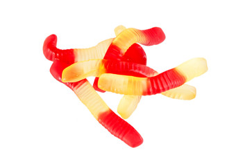 Jelly worms or snakes candies on a white background isolation