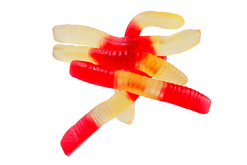 Jelly worms or snakes candies on a white background isolation