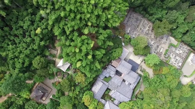 Flying by drone over a Kyoto Temple at a summer day.