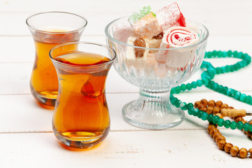 Cup of hot tea and a plate of turkish desserts