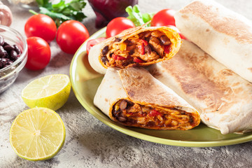 Burritos wraps with mincemeat, beans and vegetables