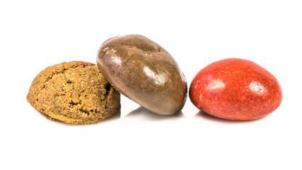 Colored pepernoten treats on white background