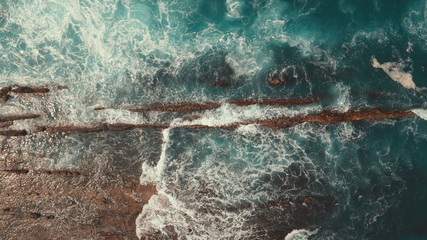 brown cliffs and big waves