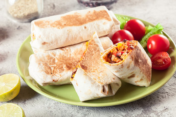 Burritos wraps with mincemeat, beans and vegetables