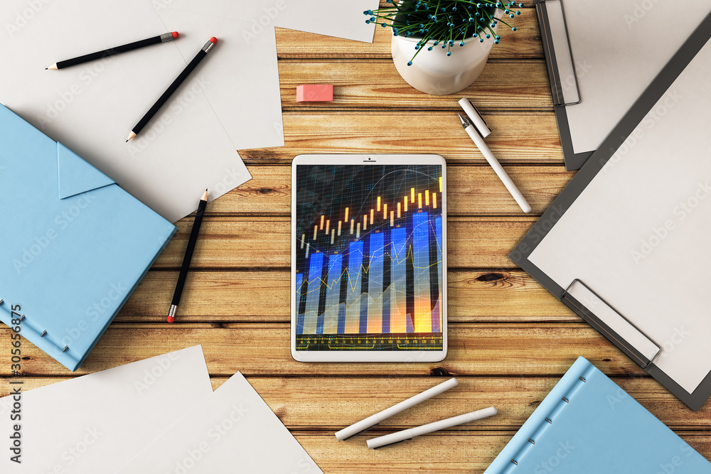 Poster digital tablet closeup top view with financial graph on screen. online trading application concept. 