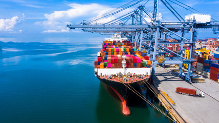 Container cargo ship at industrial commercial port in import export, China boat business commerce logistic and transportation of international by container cargo ship in the open sea, Aerial view. - obrazy, fototapety, plakaty