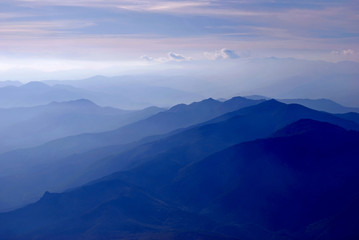 Flight above the Pyrénées with dramatic sunset, light and colors, France