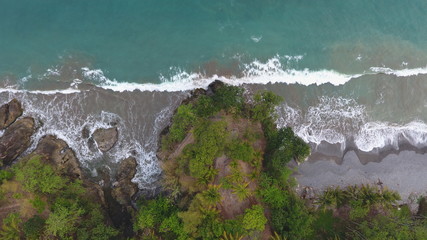 blue sea and green steep cliffs