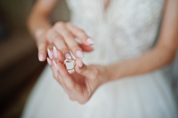 Morning of the bride preparation. Young and handsome bride at wedding day.