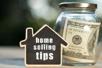 Home selling tips written on the little house shape tag - real estate concept