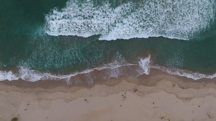 blue sea with calm waves near the shoreline
