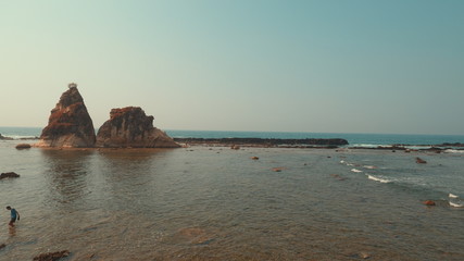 beautiful beach with high rocks