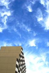 The building is beautifully colored with a backdrop of bright skies in the morning.