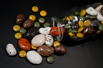 .Pebble-dragee with apricots, chocolate, mandarin and marzipan.