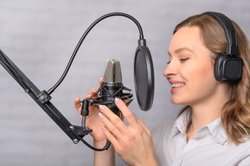 Girl with a studio microphone, Radio presenter, singer and blogger, voice acting for films. Radio...