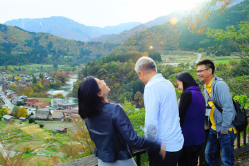 Tourists laugh happily while touring the ancient cities of Asia.