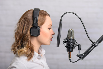 Girl with a studio microphone, Radio presenter, singer and blogger, voice acting for films. Radio...