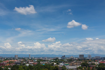 Fototapeta na wymiar white cloud on blue sky above the town, aerial view cityscape